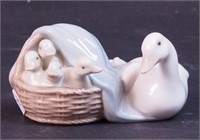 A Lladro figurine of goose and goslings,