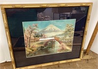 Needlework landscape in frame
