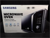 New Samsung 1.1 cu ft Microwave Oven. Opened box