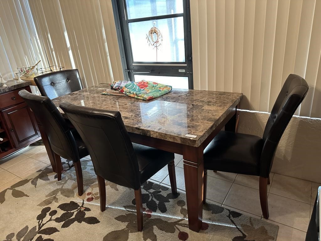 Granite top dining table with four pleather dining