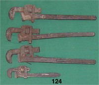 Four assorted adjustable all-steel pipe wrenches