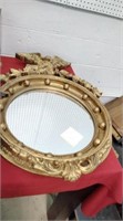 Big gold colored vintage mirror