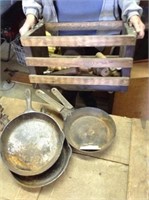 Antique crate, cast iron skillets, table legs