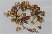 9ct gold charm bracelet with approx 35 charms