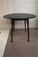 Double sided drop leaf table, one leaf has