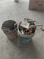 Two buckets of masonary tools - trowels,