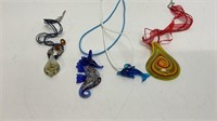 (4) glass pendant on string necklaces