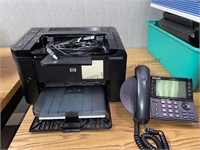 HP laserjet P1606dn printer and ShoreTel phone.