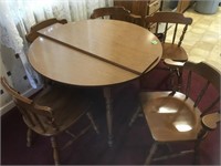table, 5 chairs, 2 leaves 42" round, 29" tall