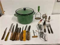 Green Enamel pot with kitchen utensils