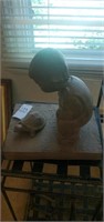 Boy and turtle statue