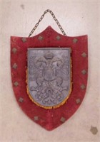 Cast metal coat of arms crest shield on velvet