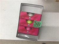 white, pink, yellow, golf balls