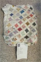 Vintage Cathedral Window patterned quilt with