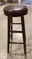 Vintage wooden barstool with padded vinyl
