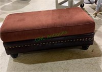 Extra large size padded ottoman with a leather