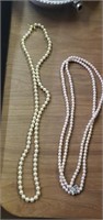 2 pearl necklaces (not sure if they're real)