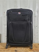 Large american tourister suitcase some wear on