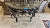 Half round glass topped table with heavy metal