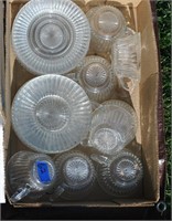 box of glass cups and saucers