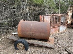 Metal fuel tank on trailer, cattle shoot
