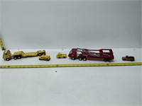 lot of 2 truck and trailer with 3 toy vehicles