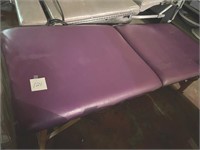 Folding massage table