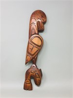 Carving, totem pole, eagle with fish,