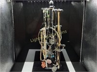 JEWELRY RACK WITH VARIOUS NECKLACES AND EARRINGS