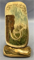 Colored scrimshaw mammoth ivory portion of a mammo