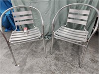 Pair Aluminum indoor / outdoor stack arm chairs.
