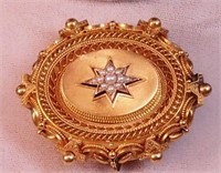 A Victorian gold-filled locket with seed pearl