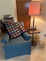 Holstered chair with floor lamp, and Afghan