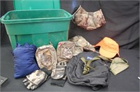 Assortment of hunting clothing, hand warmers, hats