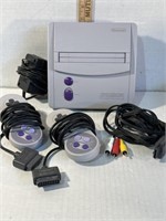 Super Nintendo Console, 2 remotes, power cord and
