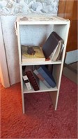 Small book case and books. And 1 end table.