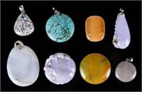 A Group of 8 Assorted Pendants