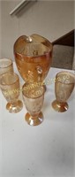 Carnival glass pitcher and 4 glasses