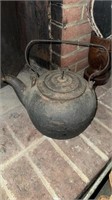 Antique iron water kettle for the fireplace