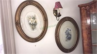 Pair of oval framed flower prints with convex