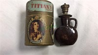 Brown pottery perfume bottle. Round box of