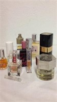 Group of various designer perfumes mostly full
