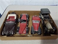 4  model cars some are from Franklin Mint