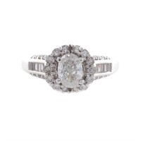 A Lady's Oval Diamond Halo Engagement Ring