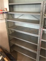 Grey metal shelf in basement  7 shelves
