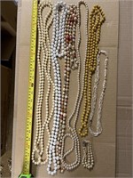 6 vintage necklaces and one bracelet,