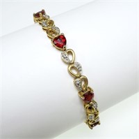 7.25" Sterling silver heart shape garnet bracelet