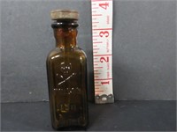 VINTAGE AMBER EMBOSSED POISON BOTTLE