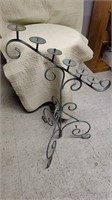 Green decorative wrought iron 6 Tier candle stand.