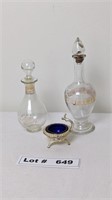 PERFUME AND LOTION DECANTERS AND SILVER PLATE COBA